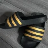Adidas Adiletten | Schwarz/Gold | Gr. 38